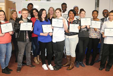 Group of college students holding certificates