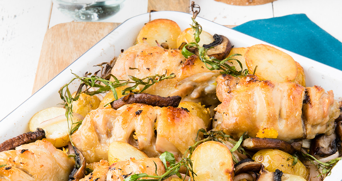 close-up of tray with roast chicken and potatoes