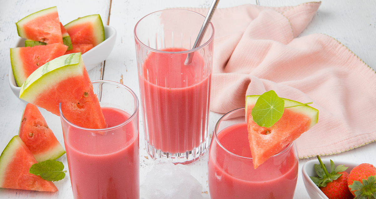 three glasses of fresh watermelon smoothie