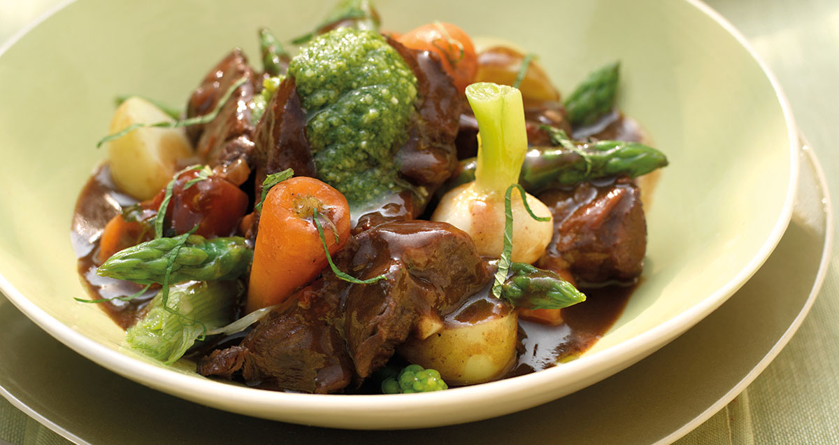 Braised mutton stew with spring vegetables and mint pesto