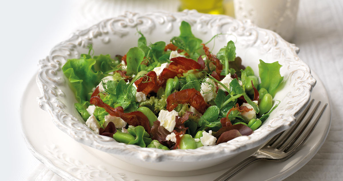 A bowl of Pancetta, broad bean, mint, and feta salad