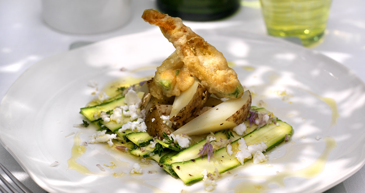 Courgette carpaccio with feta cheese and flower beignets