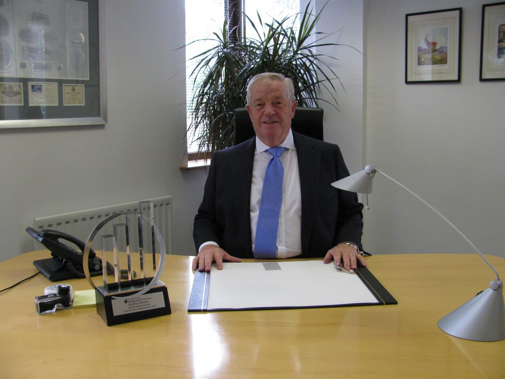 Geoffrey Harrison at his desk