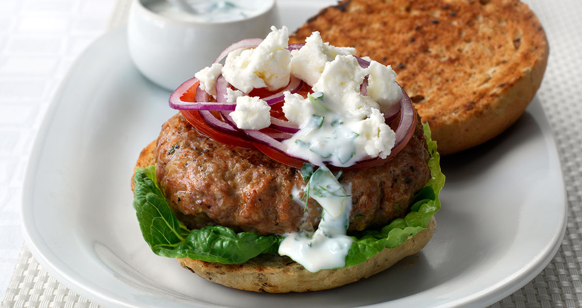 An open top Greek lamb burger on a plate