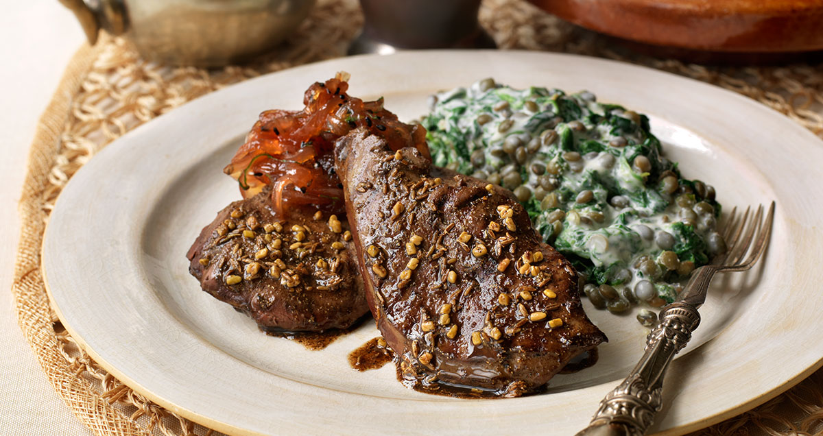 A plate of Moroccan spiced lamb's liver with onion marmalade and Puy lentils is a flavorful dish