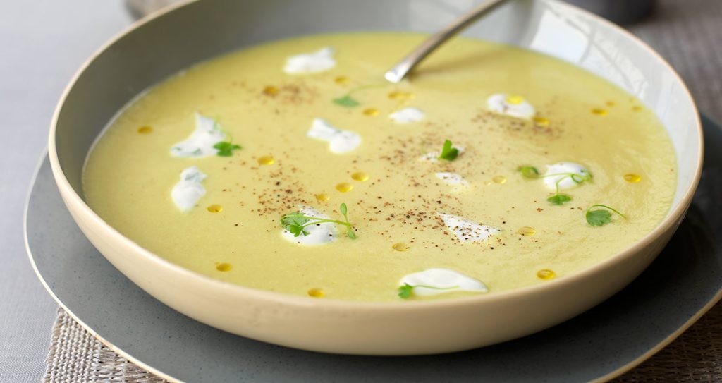 A bowl of Curried Coconut and Parsnip Soup with Coriander Yoghurt