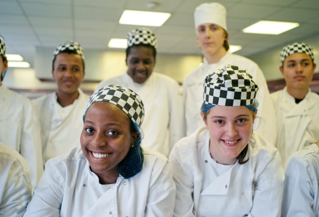 A team of chefs in work attire