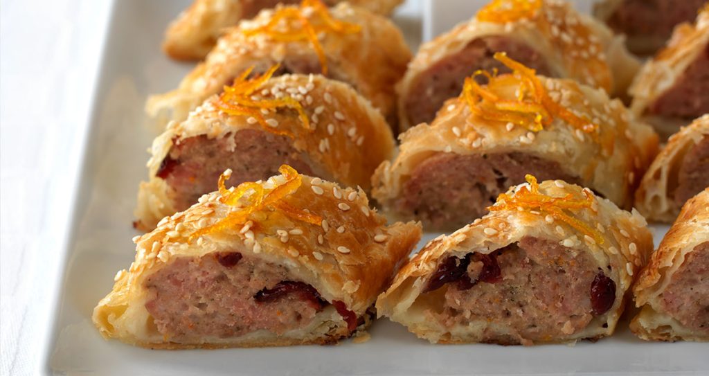 A tray of sausage rolls slices