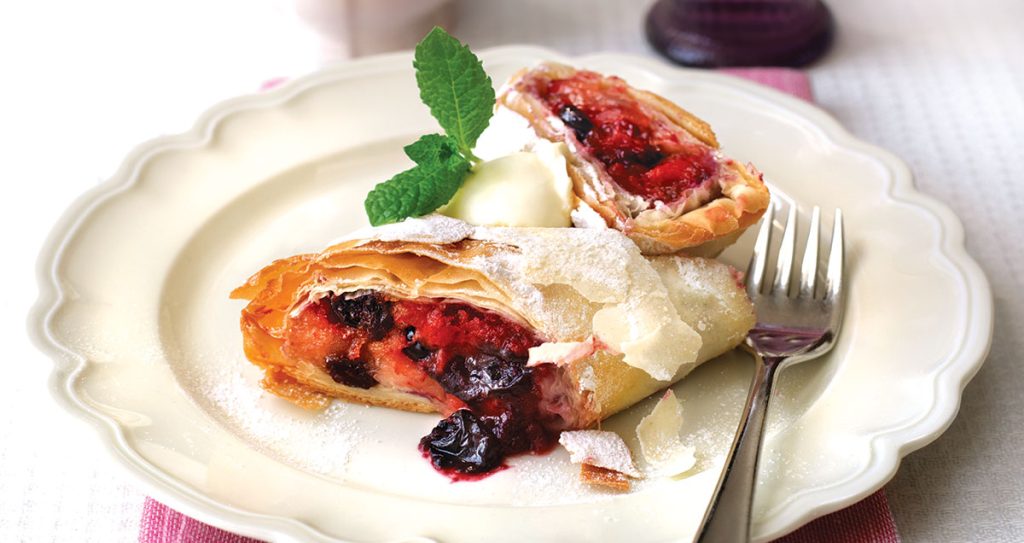 A plate of summer fruit strudel with Greek yogurt