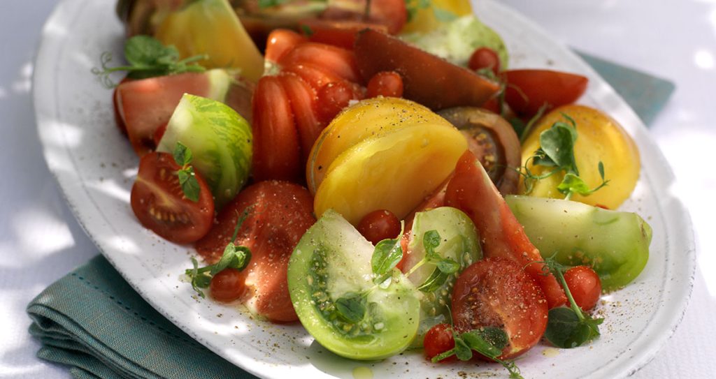 A plate of tomato salad with heritage tomatoes